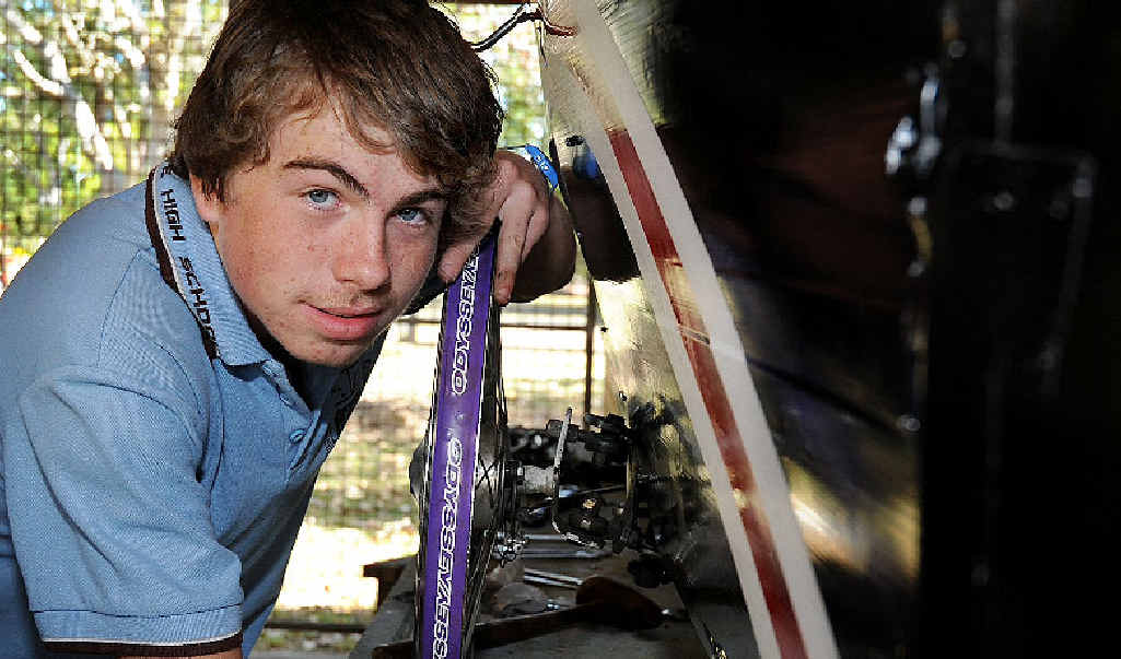 Maryborough State High student Ethan McMaster works on his team’s human-powered vehicle. Maryborough State High student Ethan McMaster works on his team’s human-powered vehicle.